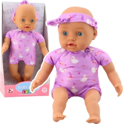 Medžiaginė kūdikio lėlė violetiniame bodžiuke su kaspinėliu, 31 cm
