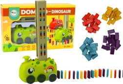 Žalias dinozauro formos automobiliukas su baterijomis, dėliojantis spalvotą domino