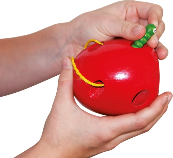 Wooden apple with an attached worm