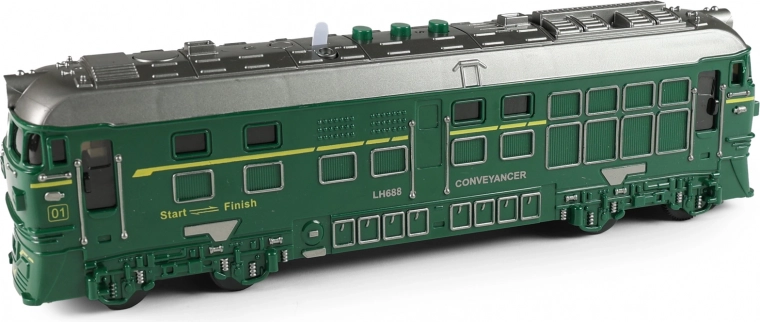 Green locomotive with sound, light, and projector