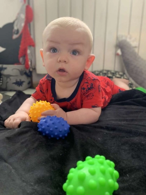 Develops touch and fine motor skills from birth