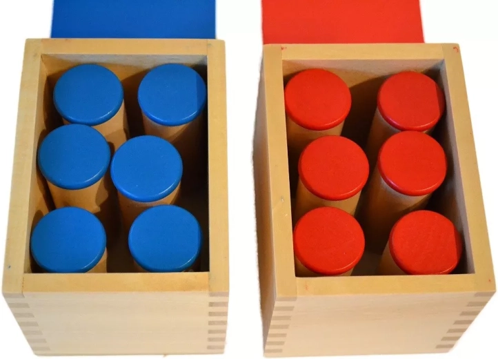 Two color-differentiated sets in wooden boxes