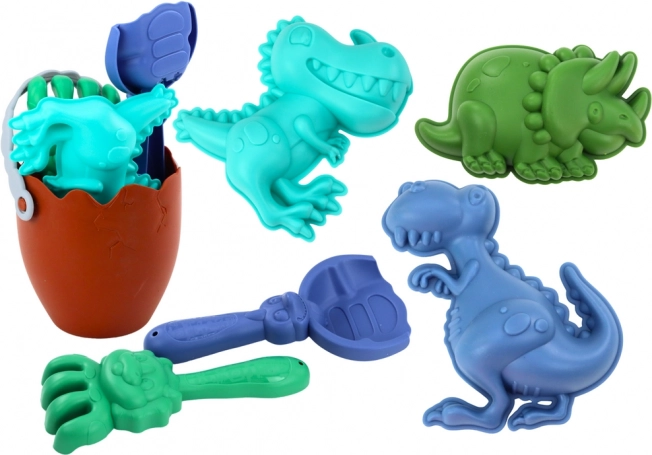 Dinosaur sand set with egg-shaped bucket, shovel, rake, and molds
