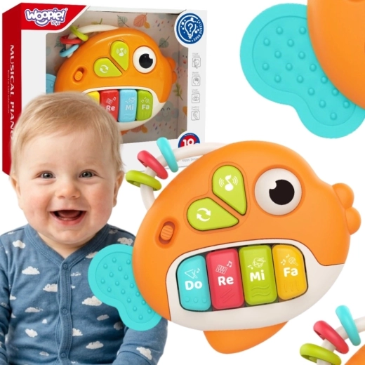 Woopie baby interaktyvi klavišinė žuvelė su garsais ir šviesa 18m+