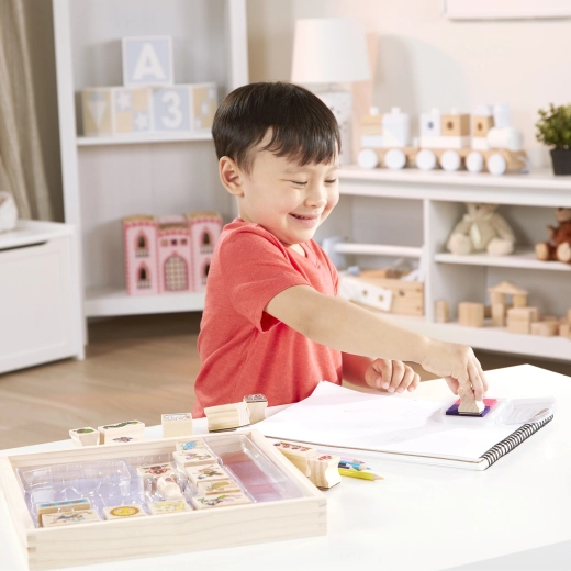 Everything stored in a wooden tray + crayons for coloring in