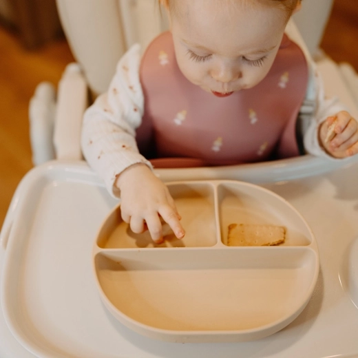 Non-slip suction base for stability on the table and high chair tray