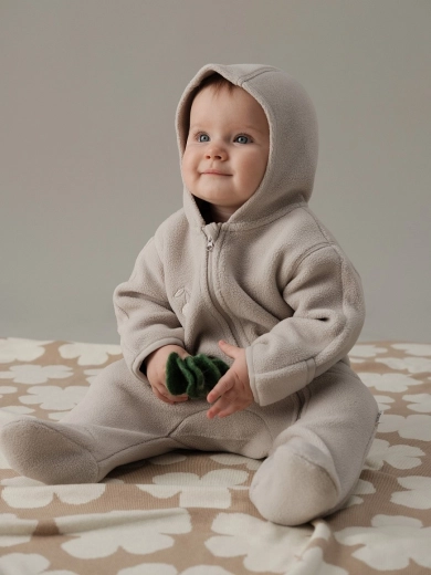 Long zipper for easy dressing and diaper changes
