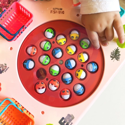 Rotating game board and magnetic fish