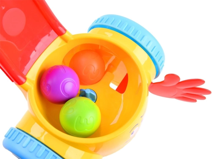 Renka ir judina spalvotus kamuoliukus