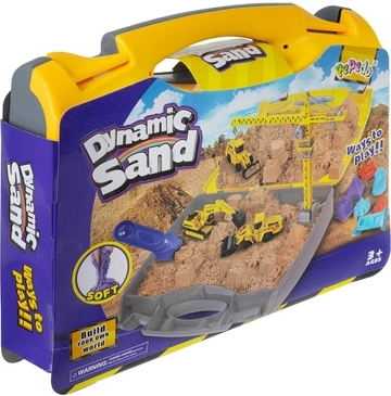 Lagaminas, kuris virsta smėlio dėže